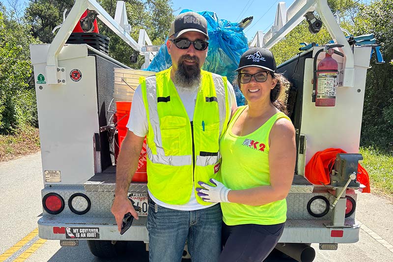 people standing near a truck on the road
